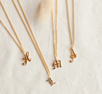 A gold initial necklace is a fashionable Mother's Day gift.