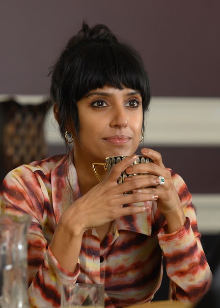 Ritu Arya stars as Lena in Nida Manzoor's "Polite Society." She holds a mug and looks at her co-star...