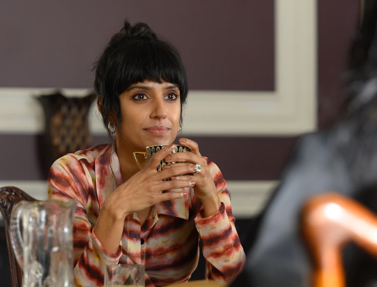 Ritu Arya stars as Lena in Nida Manzoor's "Polite Society." She holds a mug and looks at her co-star...