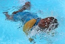 A child in the water learning ISR swimming.