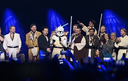 Ewan McGregor poses with fans, mostly in Jedi costumes, at the Obi-Wan Kenobi panel at Star Wars Cel...