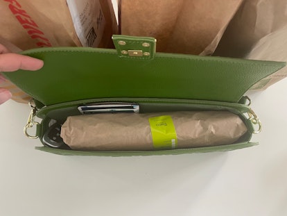 photo from the top of an open purse showing a large sandwich