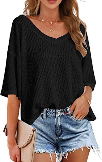 If you're looking for some casual wardrobe staples, consider this V-neck shirt with a batwing design...
