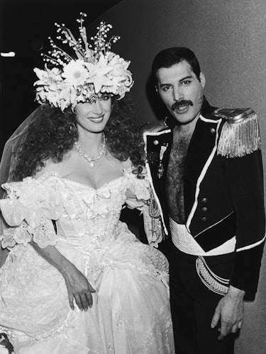 jane seymour in a white wedding dress and freddie mercury in 1985