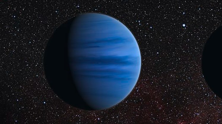 A blue planet with bands of light and dark blue on a starry black background