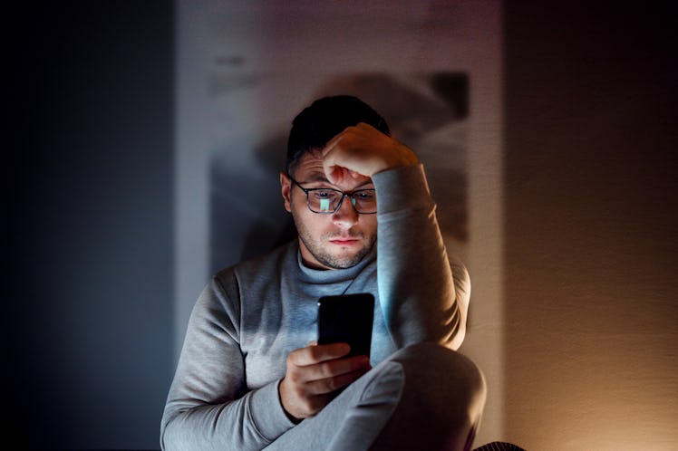 A man with high-functioning depression is on his phone.