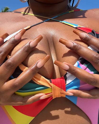 Lizzo's brown ombré french manicure nails