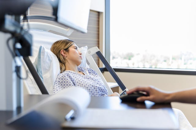 A woman looks upset in the doctor's office