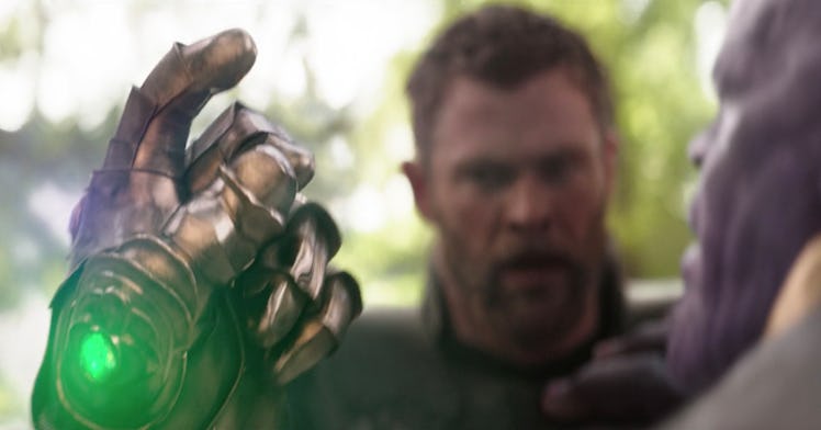 Thor (Chris Hemsworth) watches Thanos (Josh Brolin) use the Infinity Gauntlet in Avengers: Infinity ...