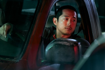 Danny (Steven Yeun) in his car looking at Amy (Ali Wong) in 'BEEF.'