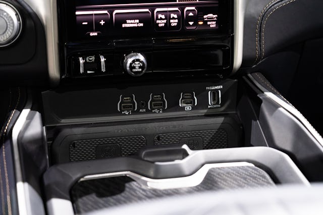 Interior USB ports and console in RAM's 2025 1500 REV electric pickup truck debuting at the 2023 New...