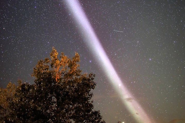 A purplish ribbon of light named Steve in the night sky.
