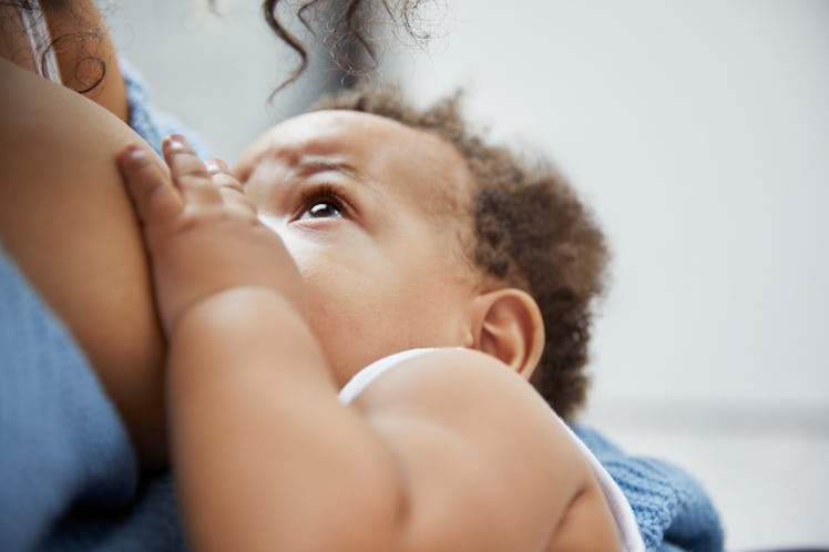 A baby breastfeeding.