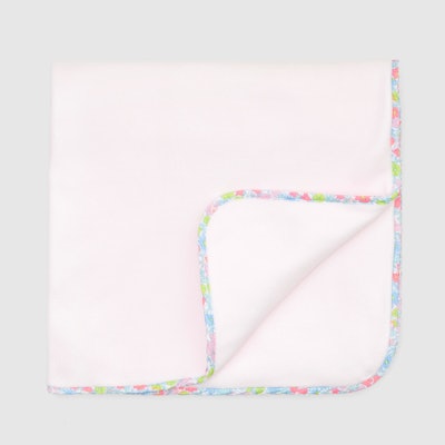 Light pink fleece and colorful Liberty floral blanket 