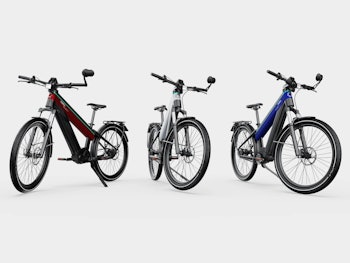 Fuell Flluid-3 e-bikes in dark red, silver, and dark blue options.