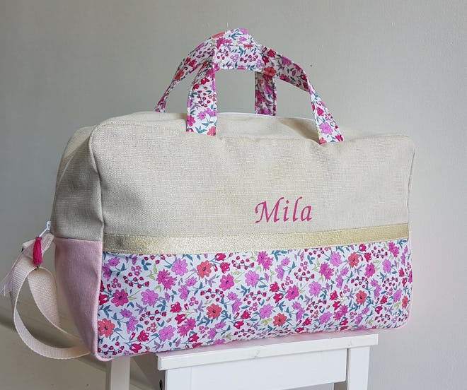 Customizable beige cotton and pink Liberty floral fabric diaper and travel bag