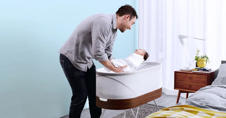 A dad using the Happiest Baby SNOO Smart Sleeper Bassinet that just got FDA De Novo approval