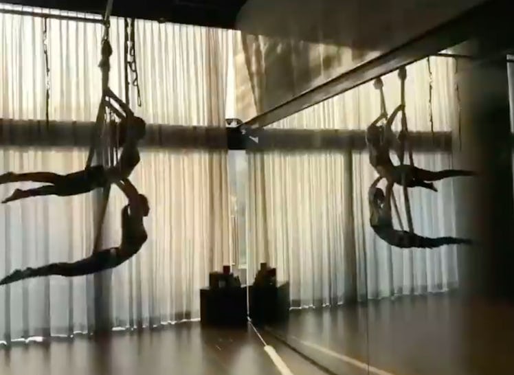 Jennie and Jisoo from BLACKPINK do aerial yoga, which is part of a BLACKPINK workout routine. 