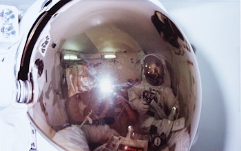 Three of the STS-6 astronaut crew in the airlock of Earth-orbiting space shuttle Challenger, where A...