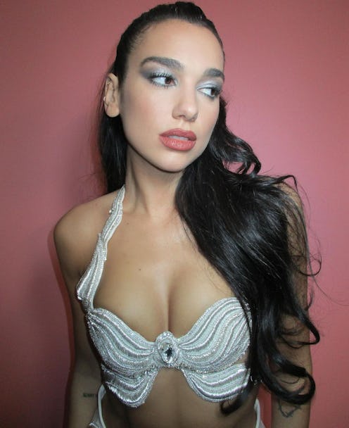 Dua Lipa's silvery eyeshadow and long curls