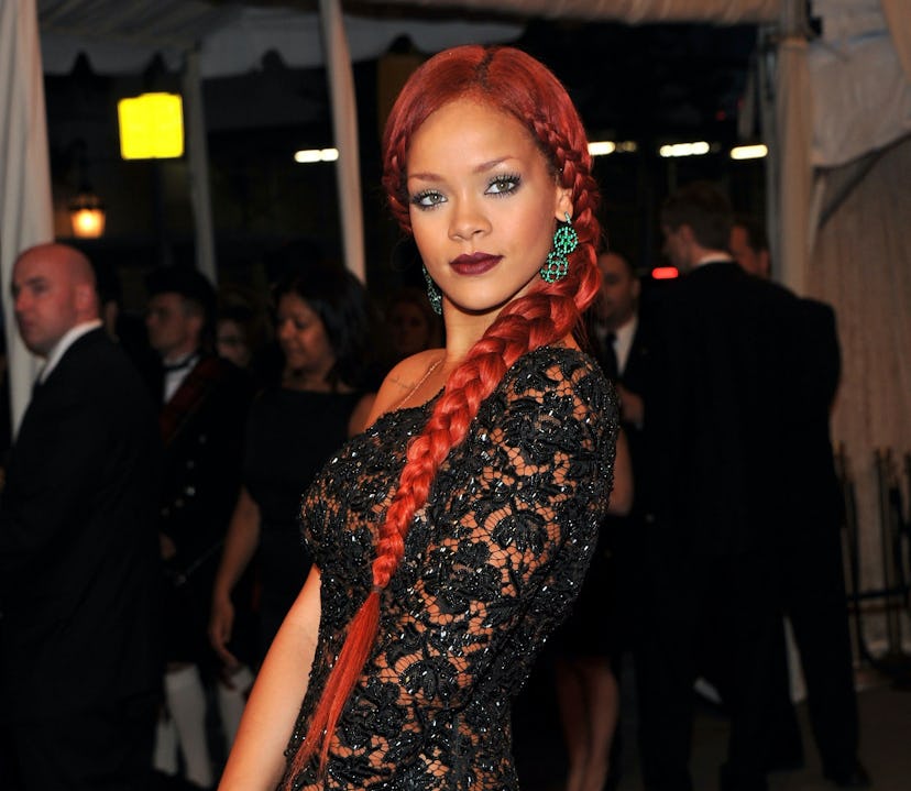 Rihanna in a long, red braid at the 2011 Met Gala.