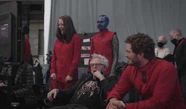 Pom Klementieff, Karen Gillan, and Chris Pratt laugh with James Gunn on the set of Guardians of the ...