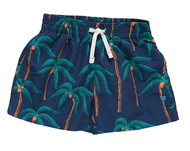 Baby swimsuits include these navy trunks with palm tree print all over