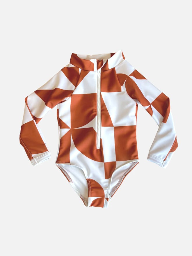 Toddler swimsuit with UPF 50 in white and rust geometric pattern