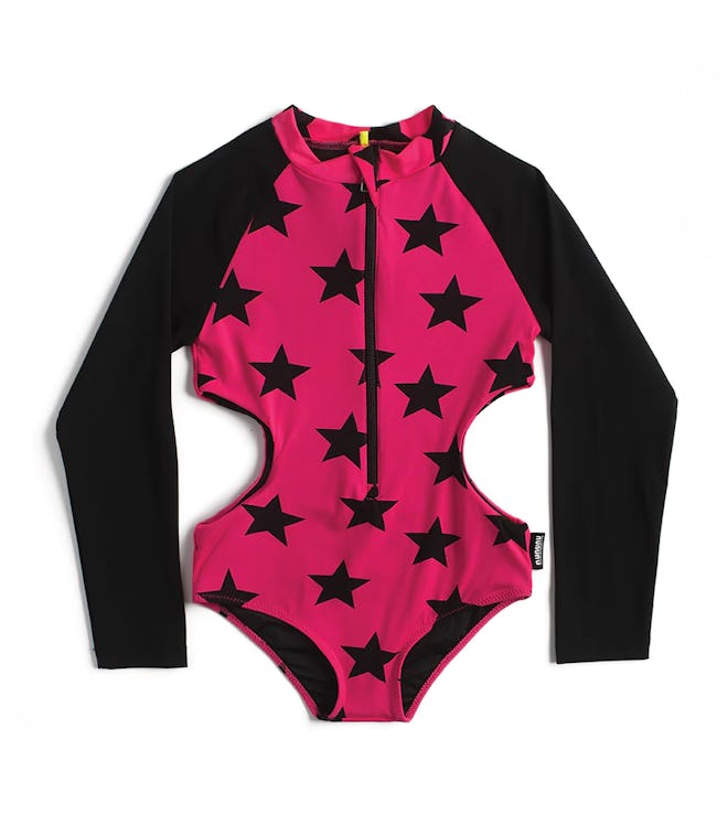 Kids swimsuit with black stars on hot pink background.