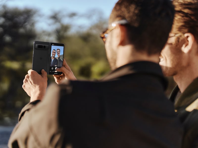 A person taking a photo on the Pixel Fold with the superior 48-megapixel camera.