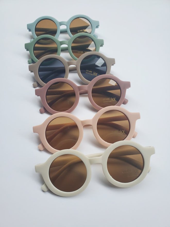 A row of sunglasses for babies, perfect to pair with baby swimsuits.