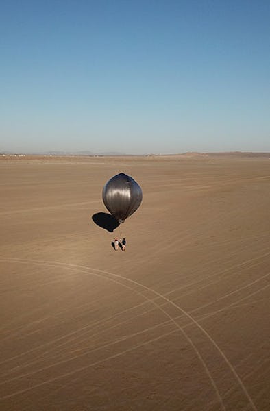 A shiny balloon in the desert