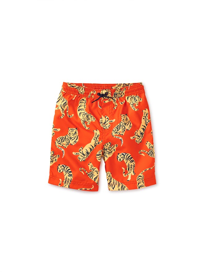Red kids' swim trunks with tiger pattern