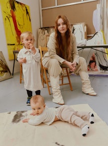 Fashion designer Elena Velez at her design studio with her children Atlas, 2, and baby Freja Lucia.