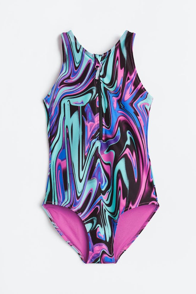 Kids' one-piece swimsuit with pink, blue, purple and black marbled pattern
