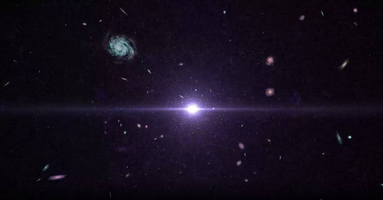 image of a bright purple light at the center of the screen, with galaxies expanding away toward the ...