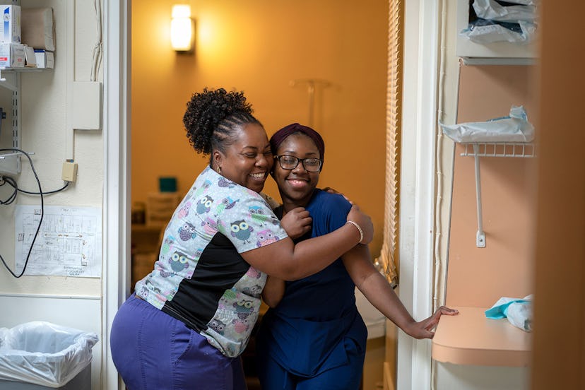 two women hugging in a list of mother's day donation ideas