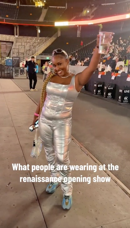 A fan wears an all-silver outfit to the Beyoncé 'Renaissance World Tour' inspired by "Alien Supersta...