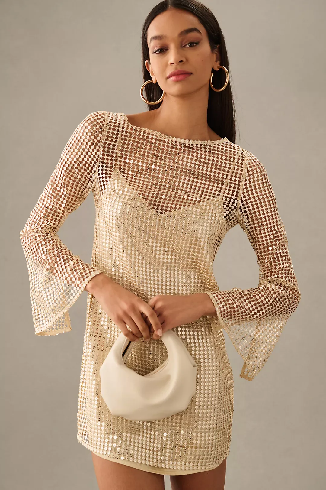 halle bailey sheer dress Modern elegance takes center stage as Halle Bailey @hallebailey dazzles in  #Chromatics collection. This gown highlights her figure with striking  shoulder details, an open back, and sheer sequin