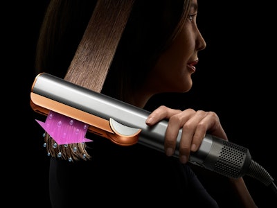 The Dyson Airstrait being used on hair.