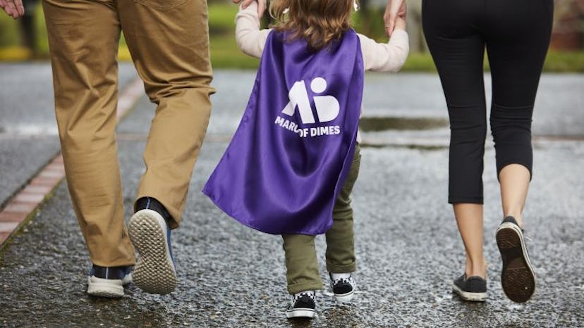 a child in a March of Dimes cape, in an list of mother's day donation ideas 