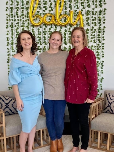 The author, her sister, and mother pose for a photo at the author's baby shower.