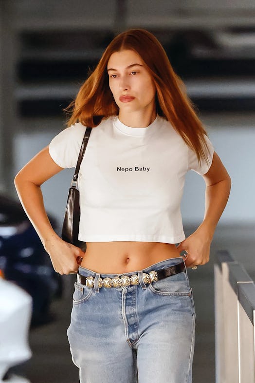 Hailey Bieber wears a white "nepo baby" t-shirt.