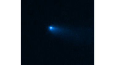 A bright dot is surrounded by a haze that slightly trails to the side. This is an image of Comet Rea...