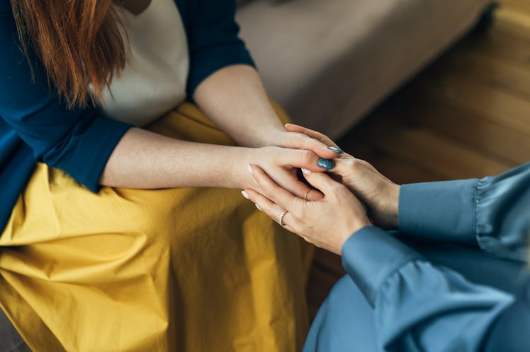 Close up of a couple holding each other's hands