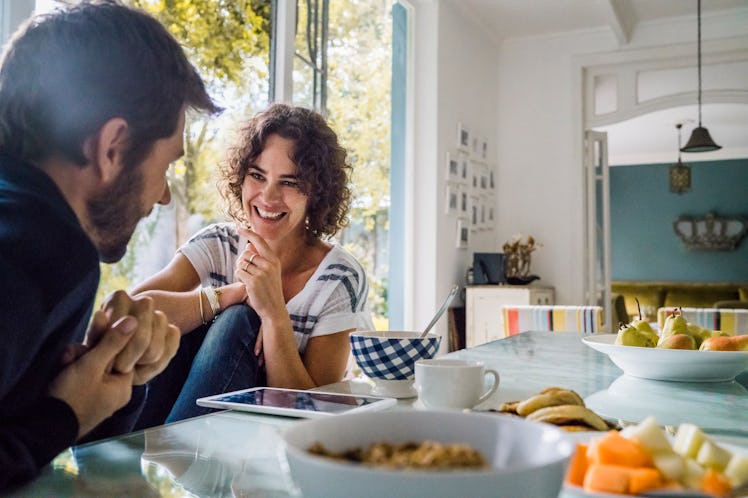 Husband and wife enjoying nice conversation at the breakfast table