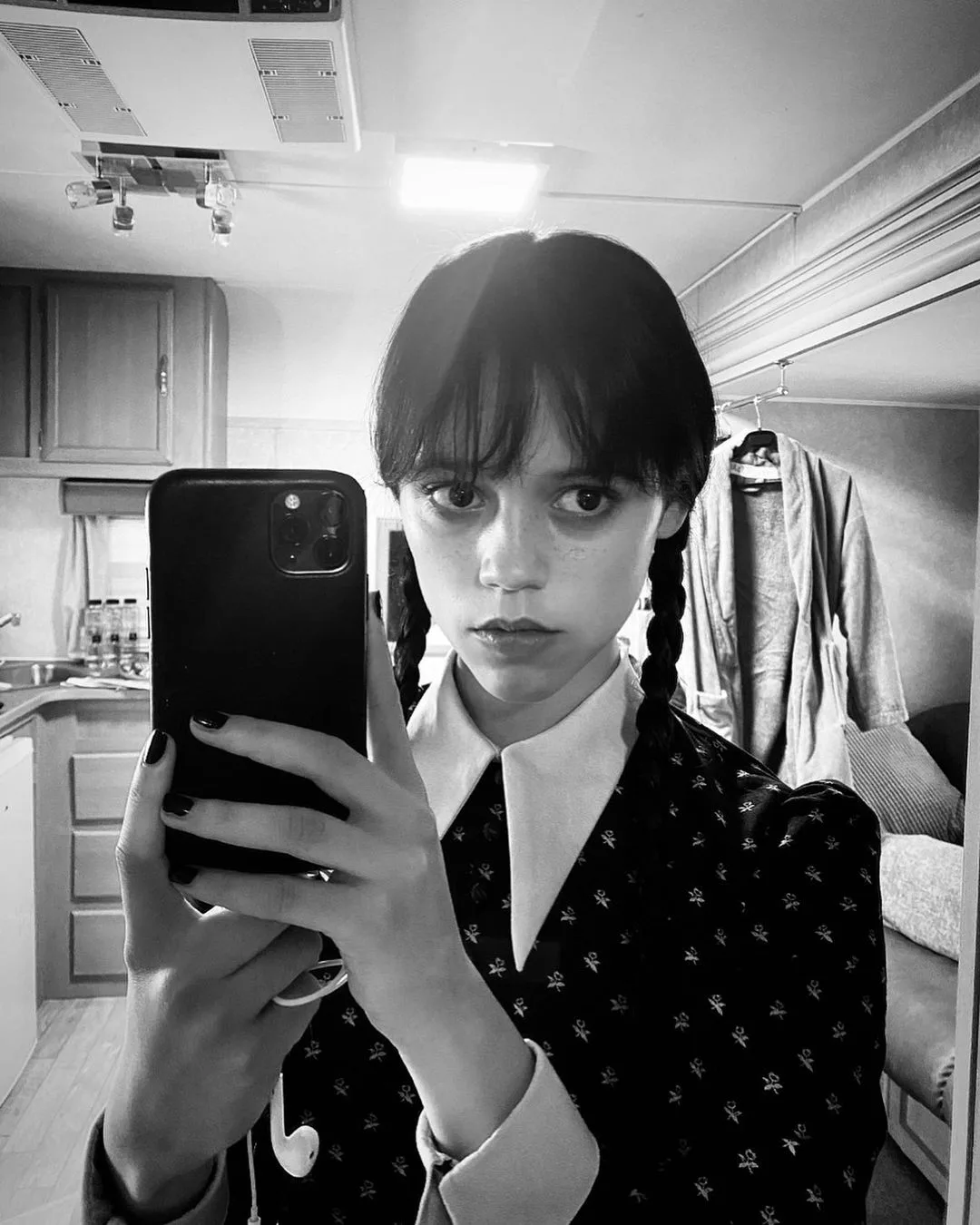 Jenna Ortega's iconic Wednesday Addams' hairstyle.