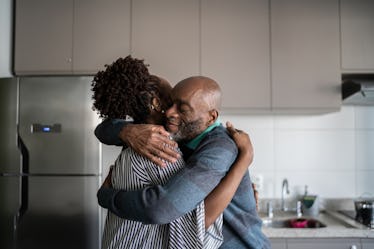 Man and woman hugging in the kitchen