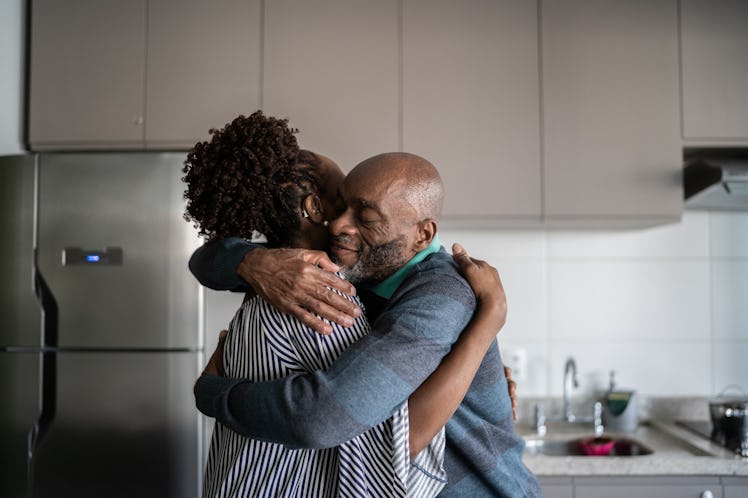 Man and woman hugging in the kitchen