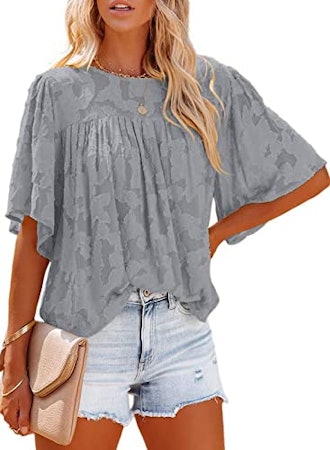 If you're looking for comfortable tops for summer, check out this lacey blouse with bell sleeves.